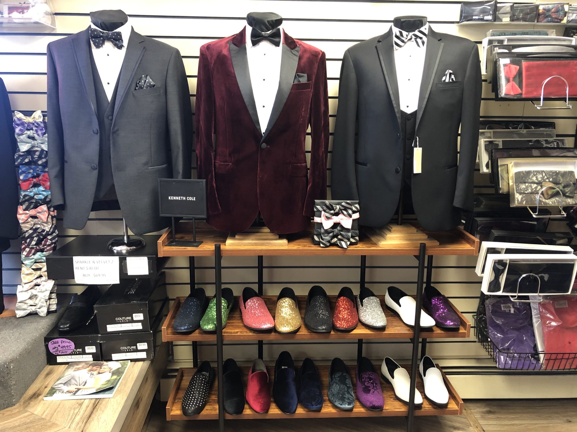 A store with suits and shoes on display.